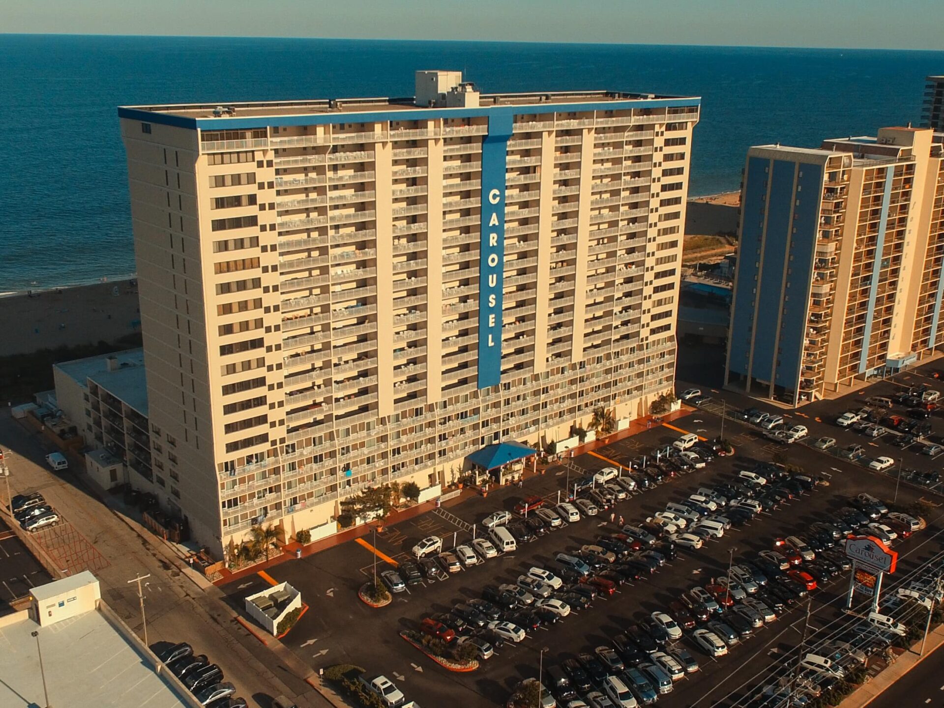 an aerial view of a hotel near the ocean