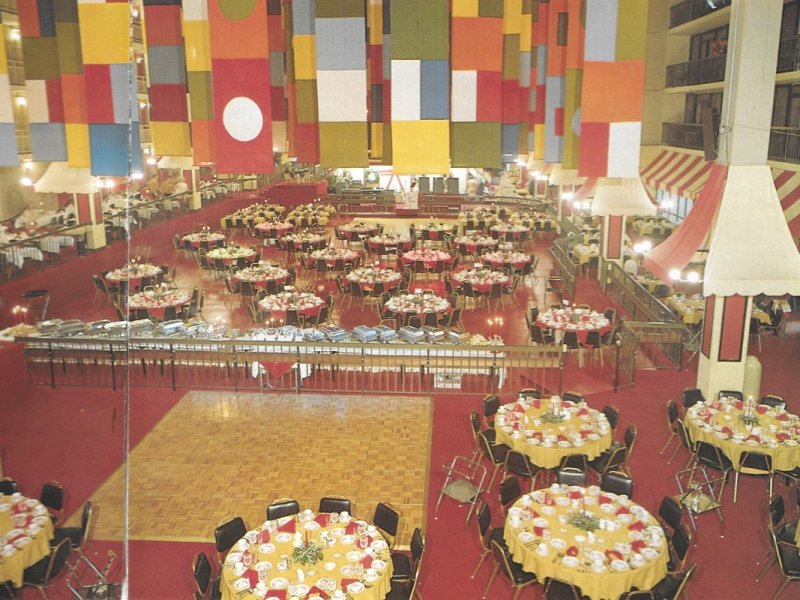 a large room with tables and chairs in it
