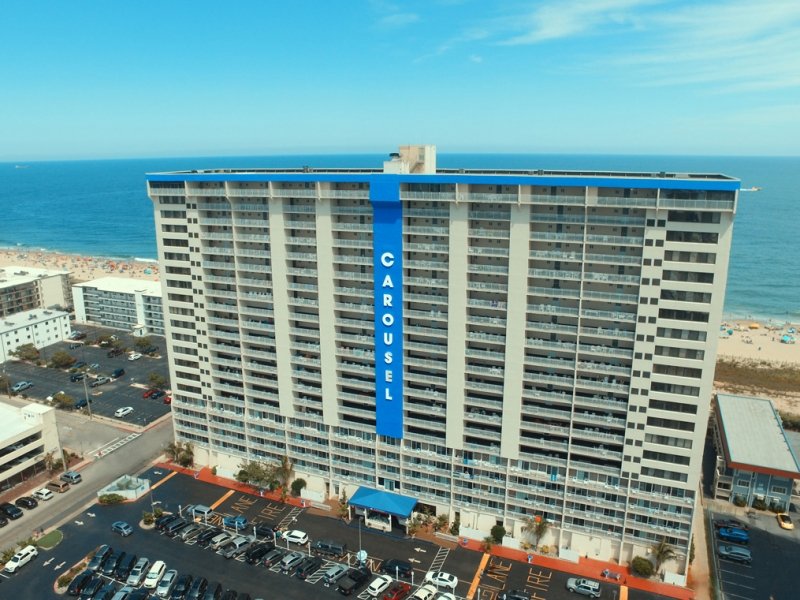 an aerial view of a hotel near the beach