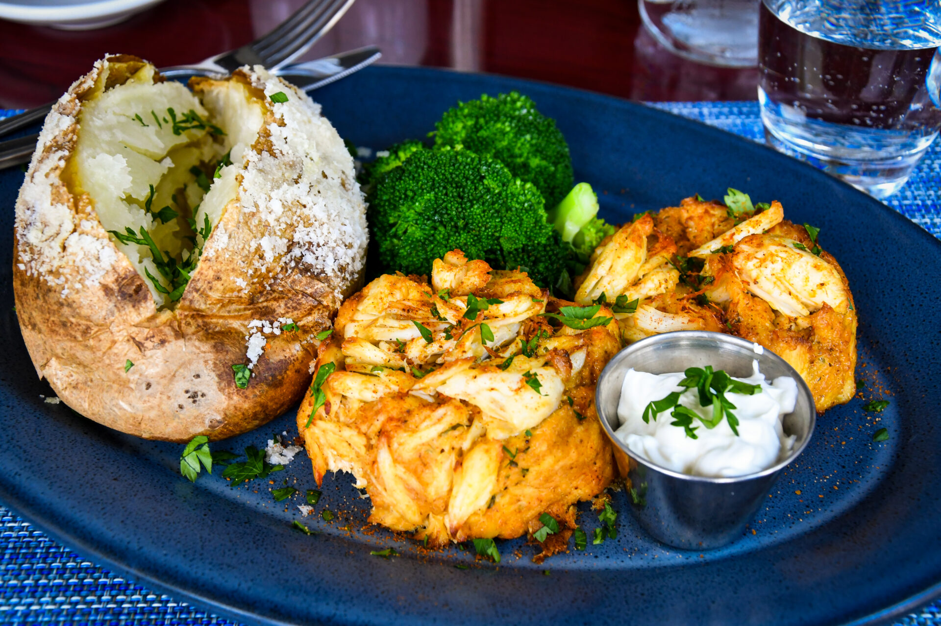 a blue plate topped with different types of food